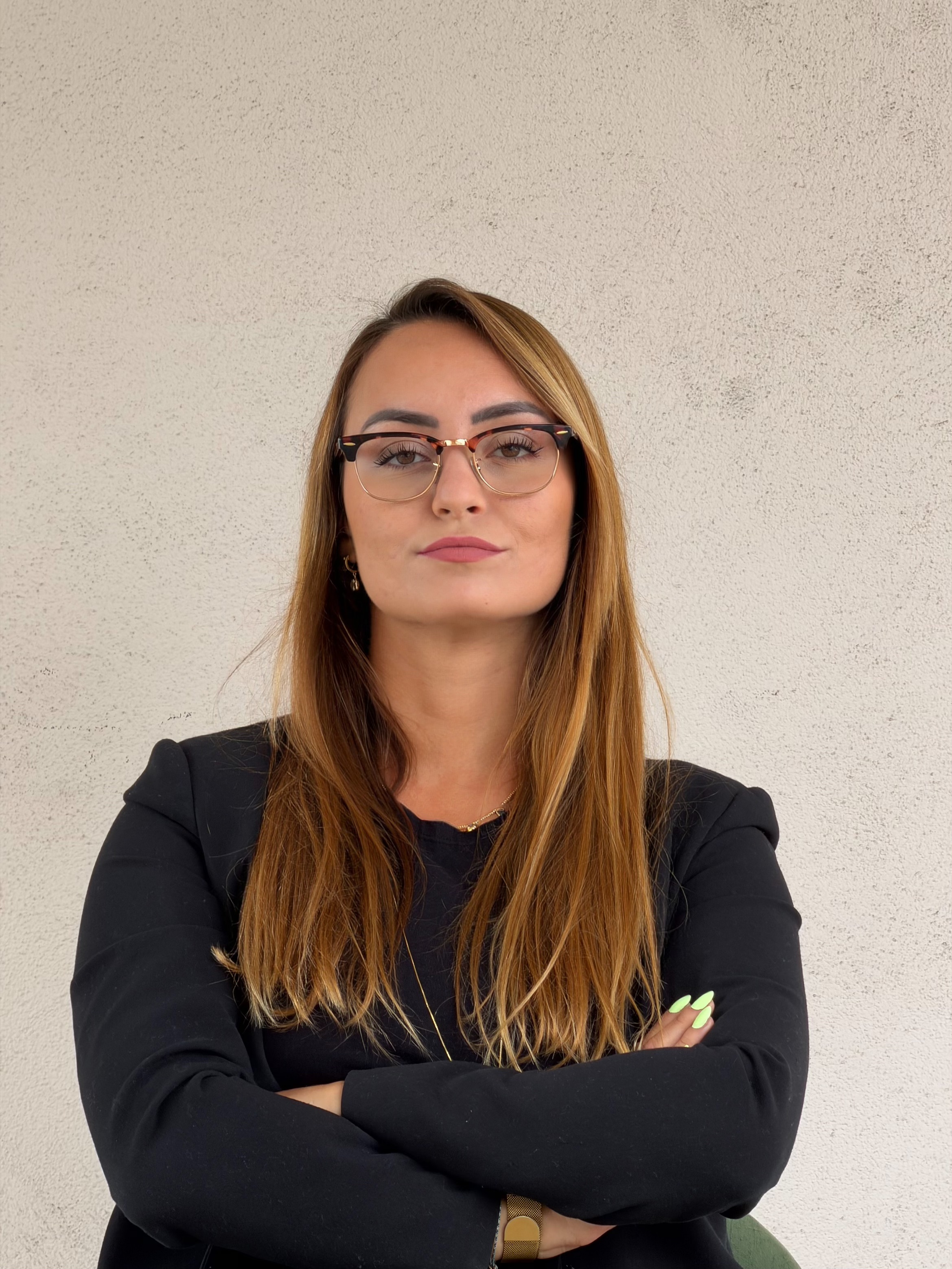 Danielle Vantini — authority pose, arms crossed