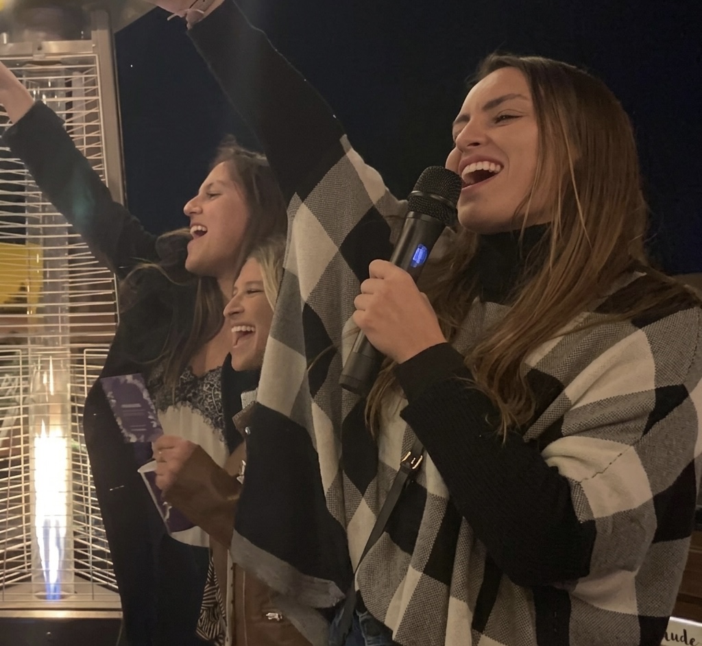Danielle Vantini laughing on stage with audience